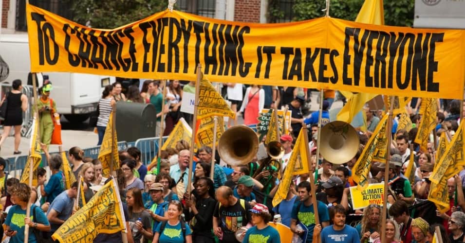 Thousands march in Traverse City demanding action on clean energy in Michigan and beyond