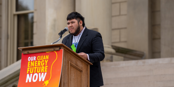 Michigan LCV West Michigan Campus Organizer Ernesto Garza speaking at last year's Climate Rally For Our Future in Lansing. 