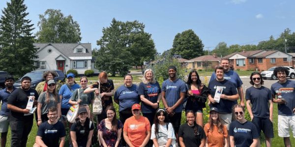 Ernesto (far left holding a door hanger) with other Our Water Activists and Michigan LCV staff with State Representative Jenn Hill during OWA's trip to Marquette to canvass. 