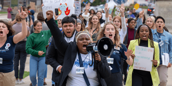 Ernesto (second row behind young woman with the megaphone) during the Climate Rally For Our Future in Lansing last September, marching with other students from all over Michigan in support of climate action. 